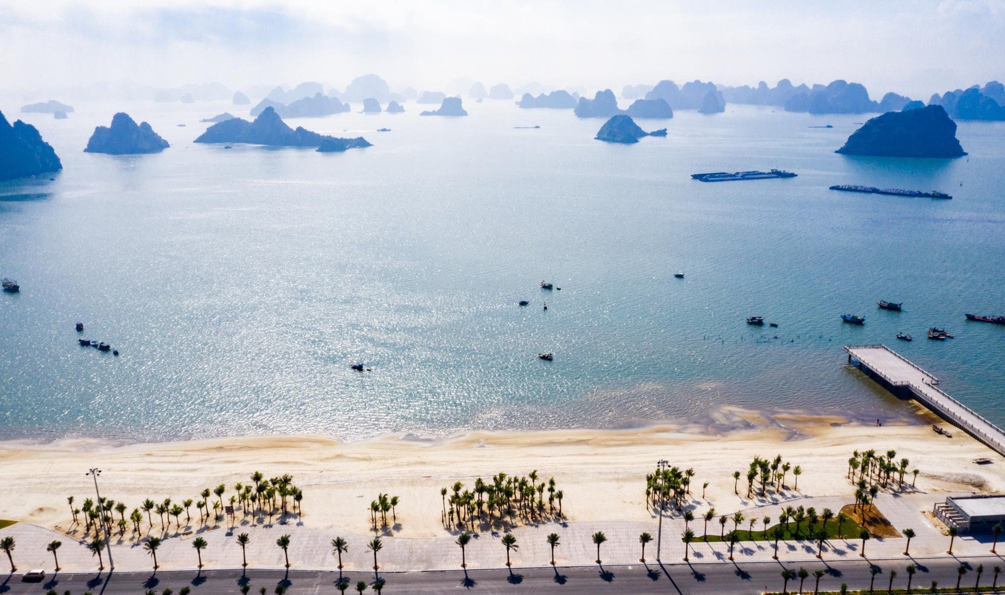 Bai Chay is the largest man-made beach in Ha Long, boasting a 1000-meter sandy stretch and clear waters near the city center